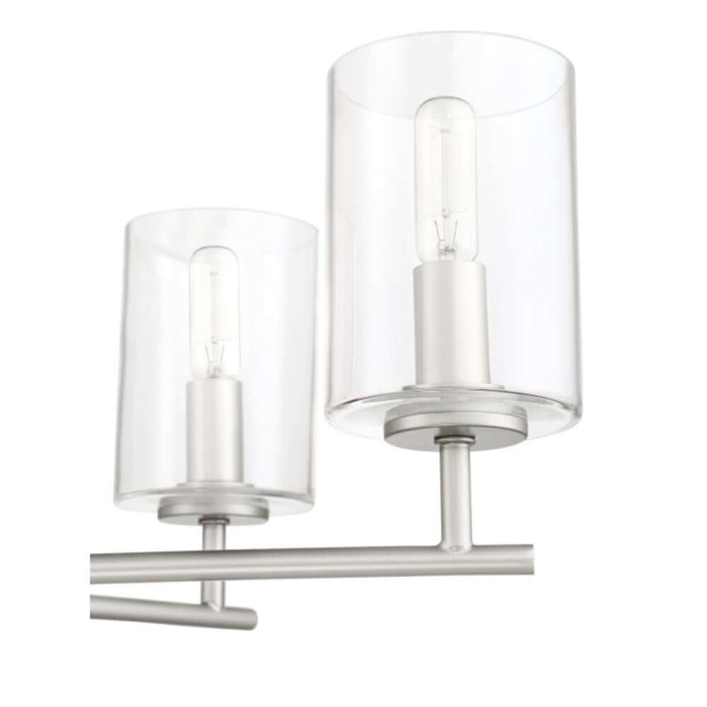 Clear glass cylinder globes of the Craftmade Hailie 6 Light Chandelier in polished nickel, showcasing modern elegance.